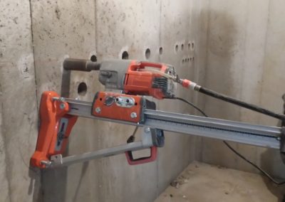 core drilling into wall with core driller